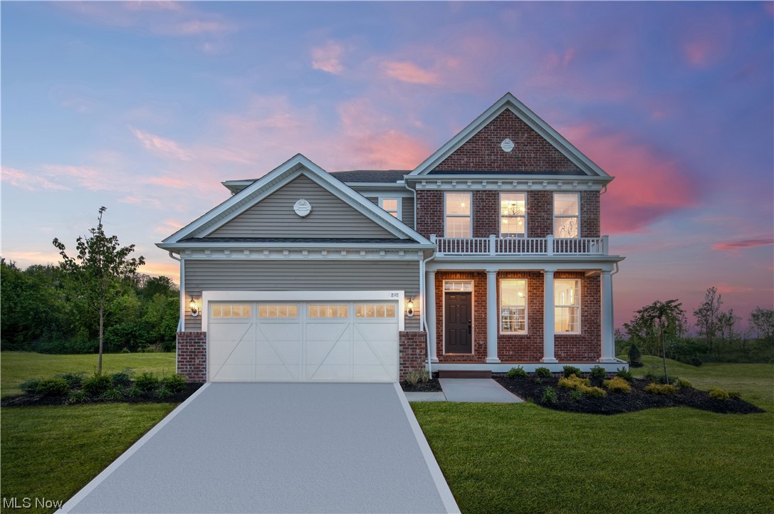 898 River Run Road Aurora, OH 44202 - Photo 1 of 15 View of front of home featuring a yard, a garage, and a balcony