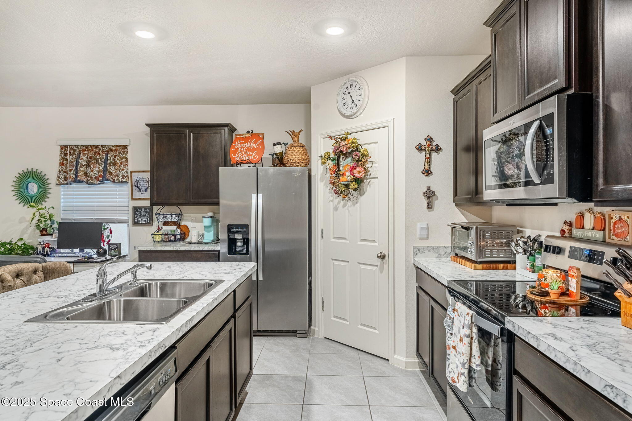 4901 Talbot Boulevard Cocoa, FL 32926 - Photo 13 of 39 a kitchen with stainless steel appliances granite countertop a sink stove and refrigerator