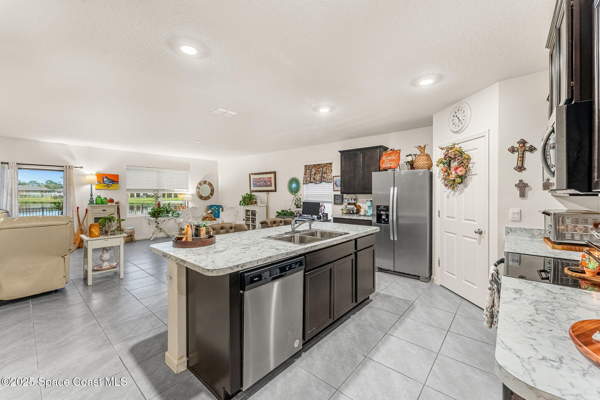4901 Talbot Boulevard Cocoa, FL 32926 - Photo 14 of 39 a kitchen with stainless steel appliances granite countertop a stove refrigerator and a sink