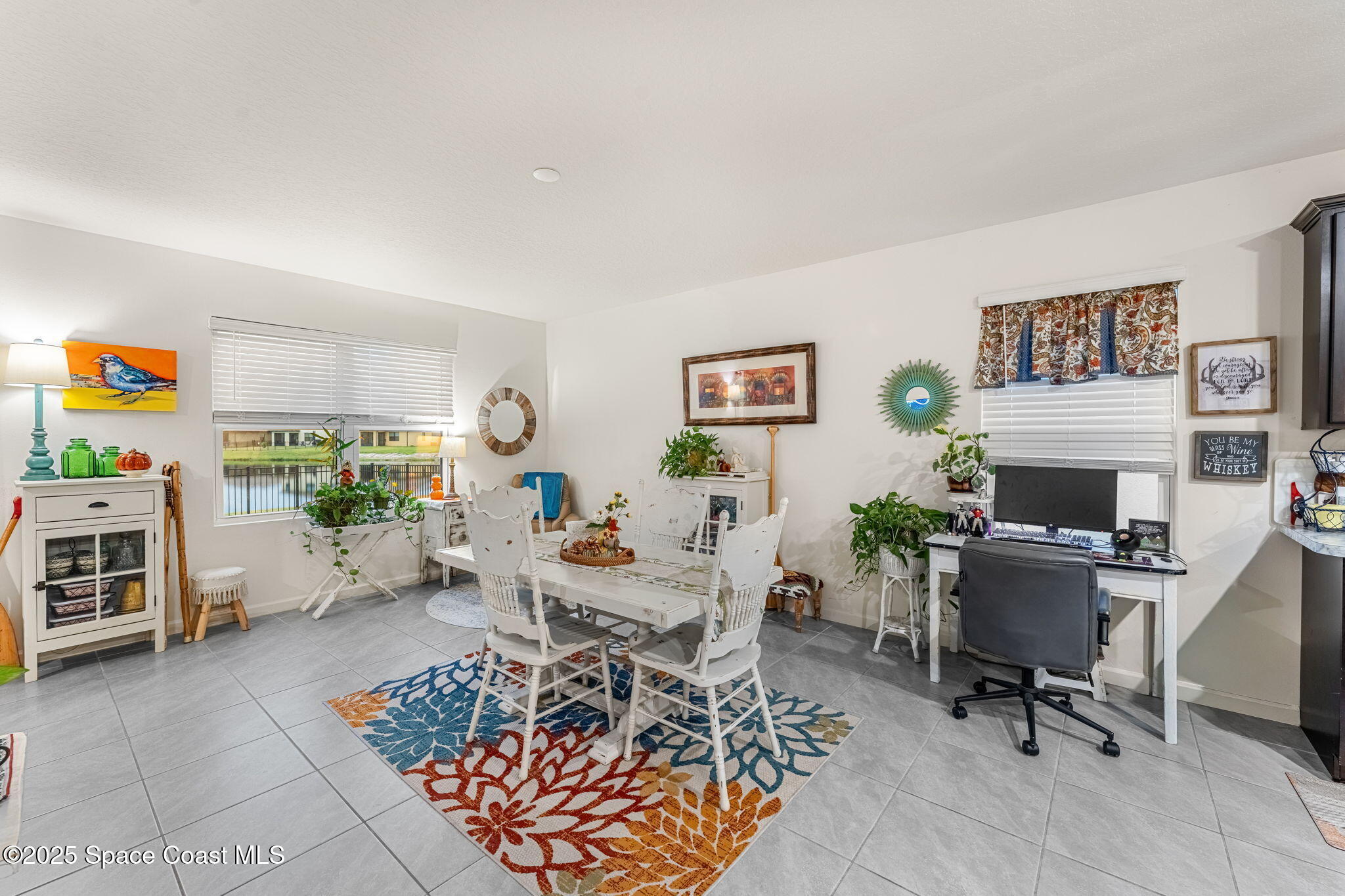 4901 Talbot Boulevard Cocoa, FL 32926 - Photo 15 of 39 a living room with furniture a rug and a window