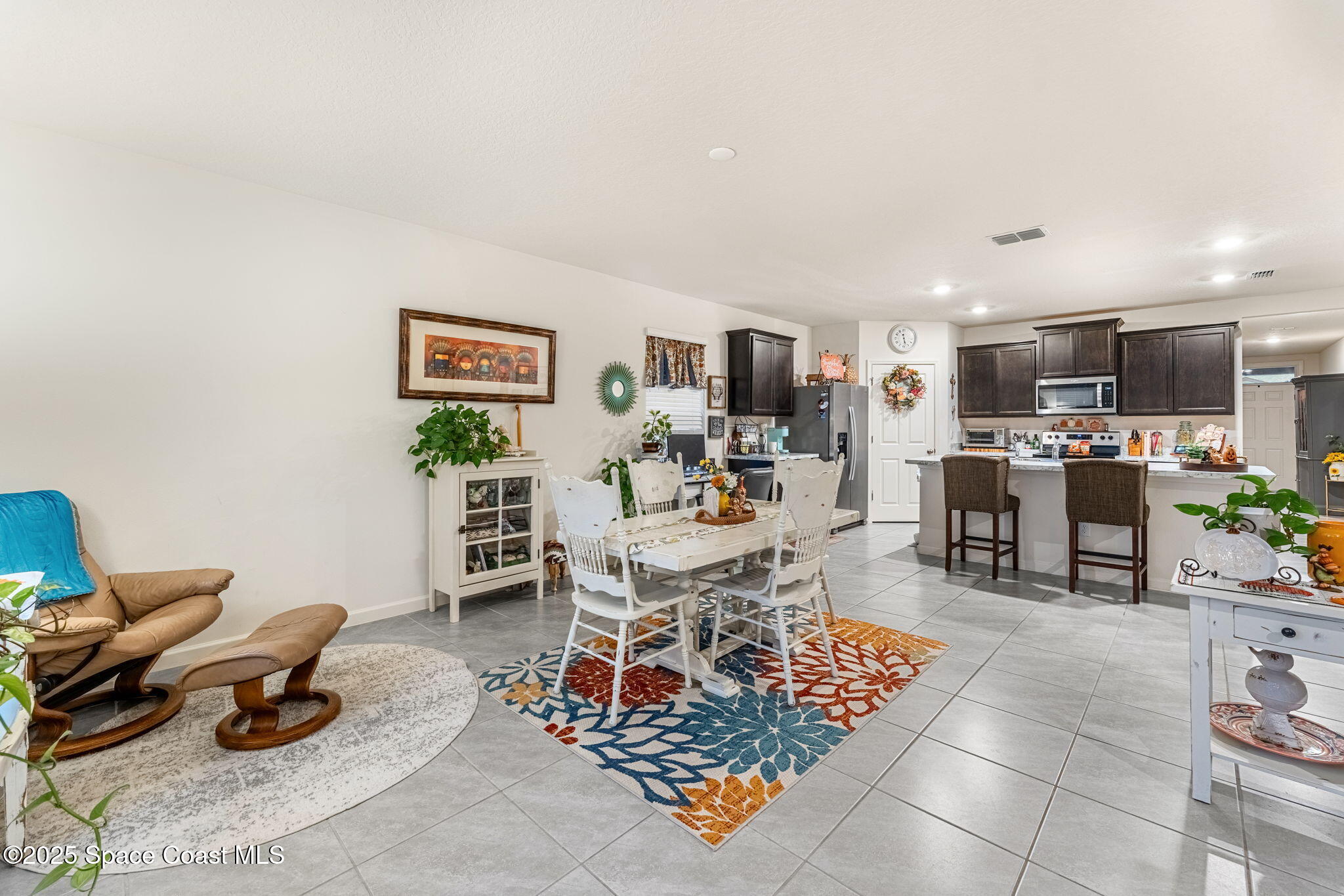 4901 Talbot Boulevard Cocoa, FL 32926 - Photo 16 of 39 a living room with furniture and a kitchen view