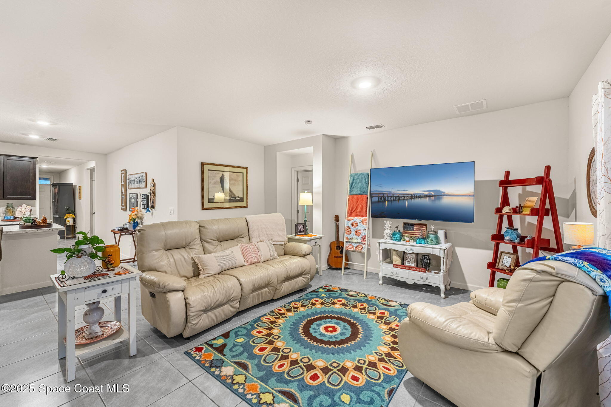 4901 Talbot Boulevard Cocoa, FL 32926 - Photo 17 of 39 a living room with furniture and a flat screen tv