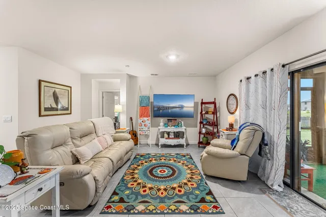 a living room with furniture and a rug