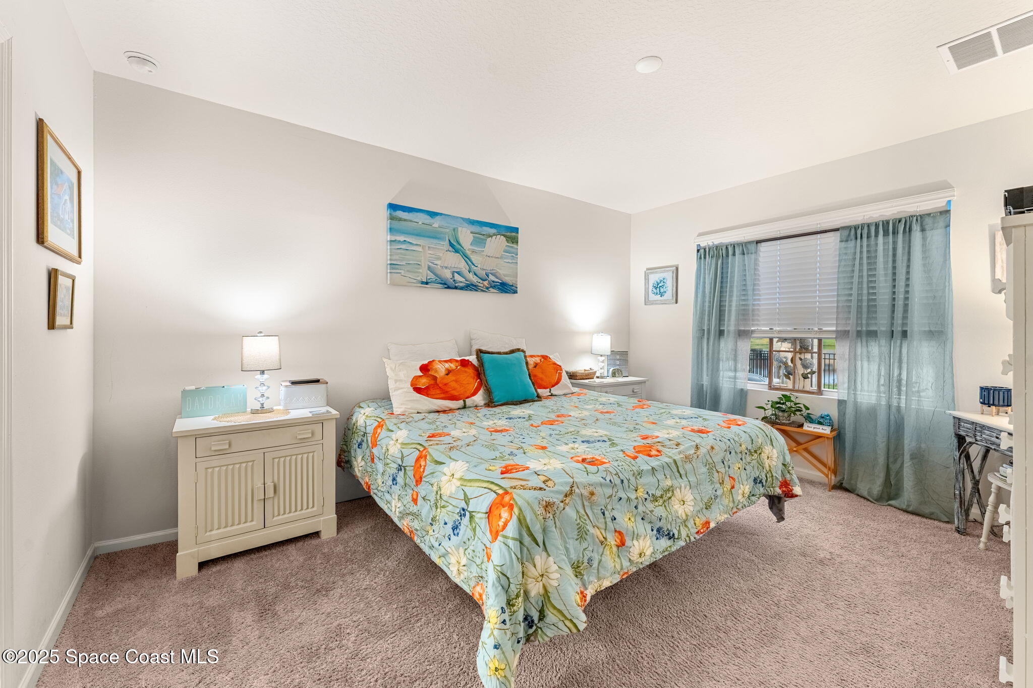 4901 Talbot Boulevard Cocoa, FL 32926 - Photo 20 of 39 a bedroom with a bed and a table