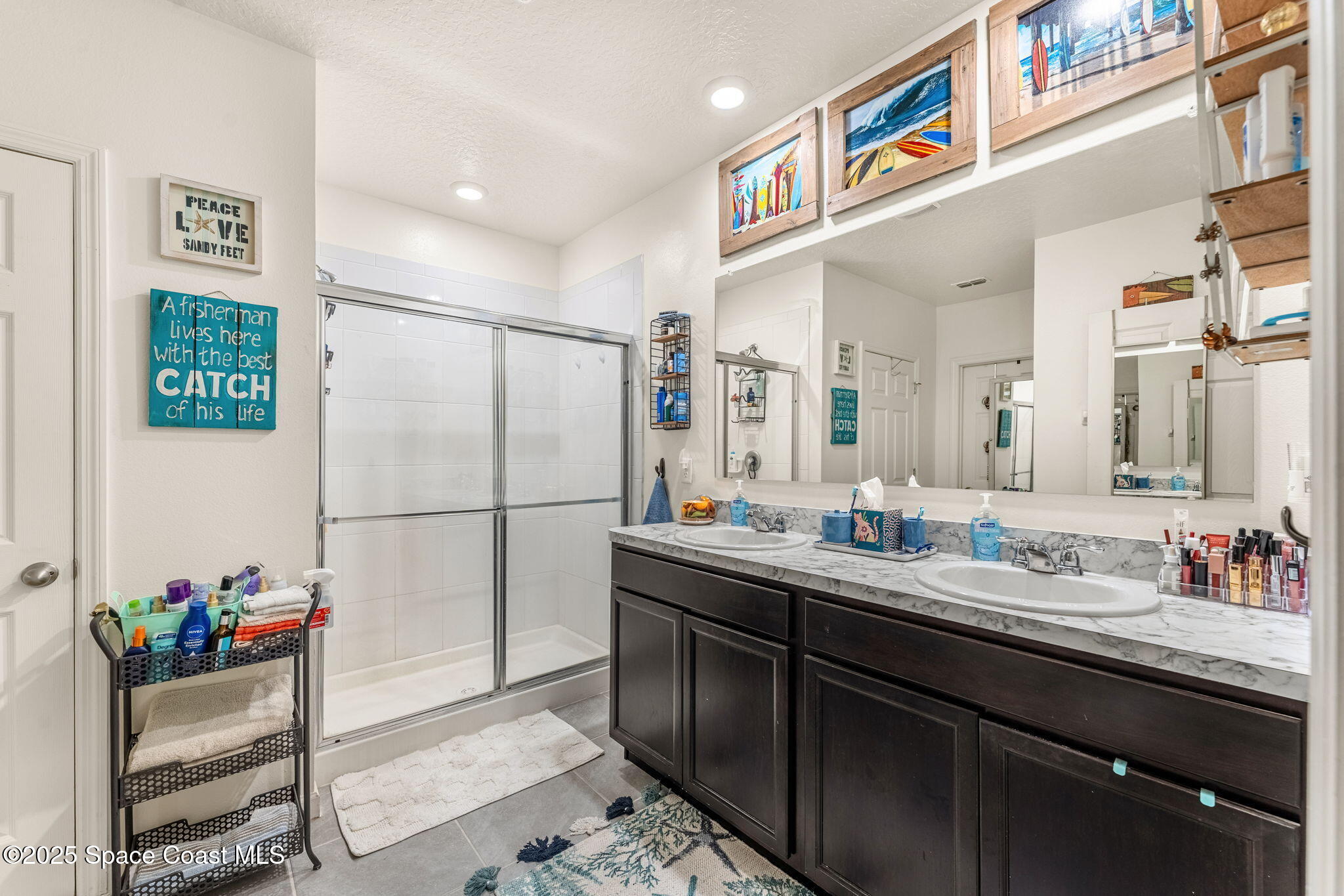 4901 Talbot Boulevard Cocoa, FL 32926 - Photo 22 of 39 a bathroom with a sink and a mirror