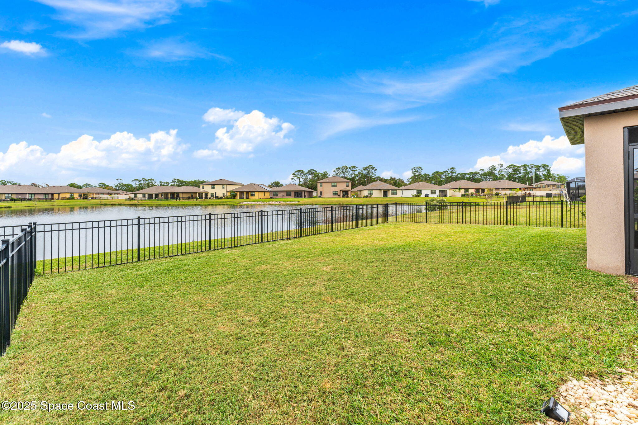 4901 Talbot Boulevard Cocoa, FL 32926 - Photo 26 of 39 a view of a lake with houses in the back