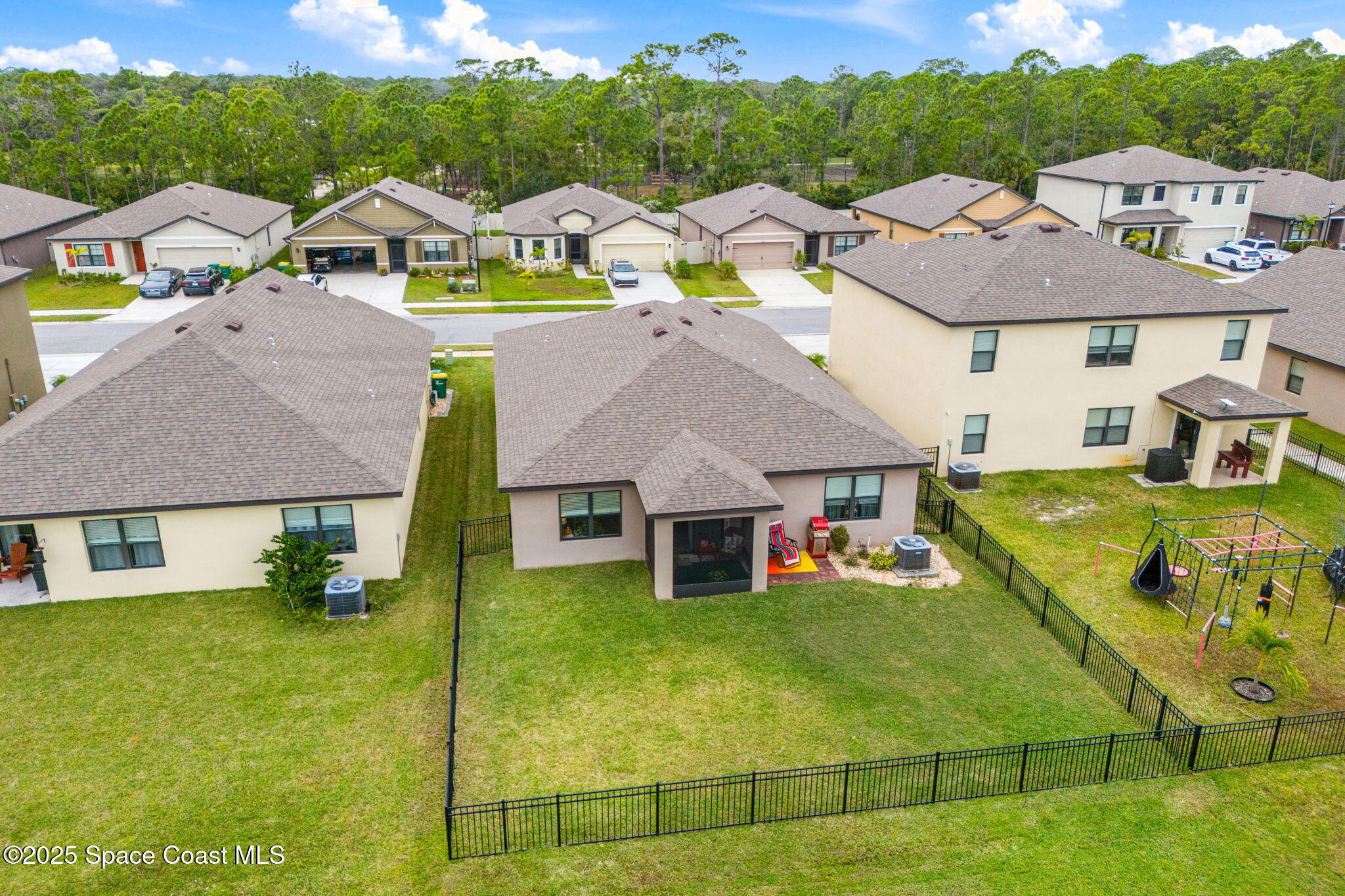 4901 Talbot Boulevard Cocoa, FL 32926 - Photo 29 of 39 a aerial view of a house with swimming pool and a yard