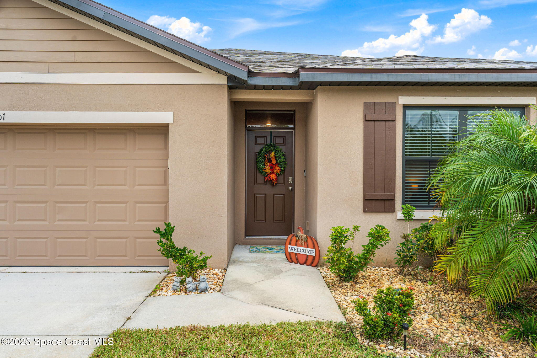 4901 Talbot Boulevard Cocoa, FL 32926 - Photo 3 of 39 a front view of a house with a yard