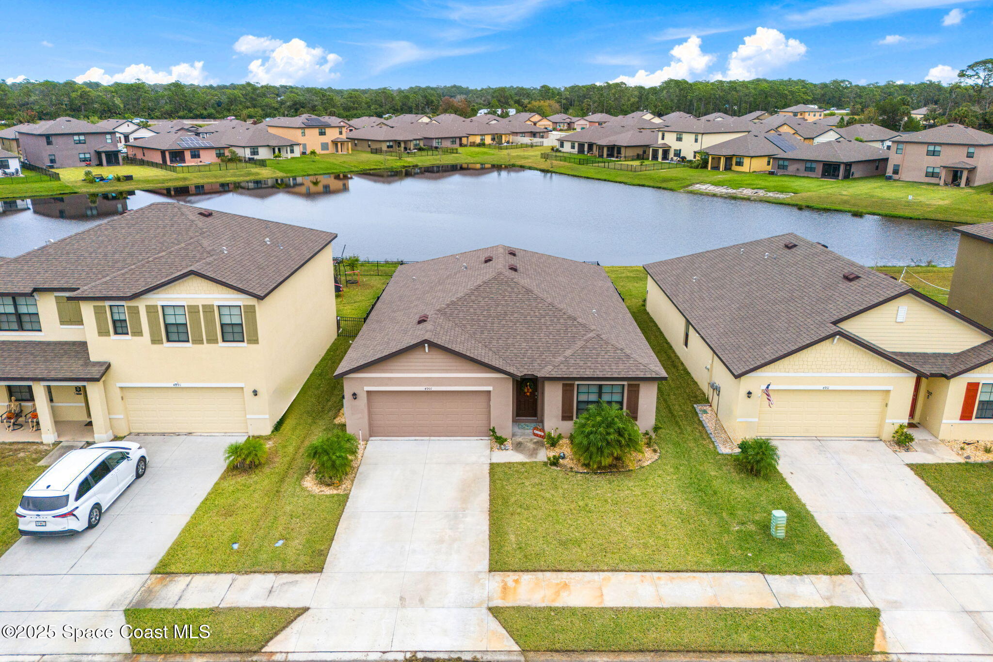 4901 Talbot Boulevard Cocoa, FL 32926 - Photo 31 of 39 a aerial view of a house with a swimming pool yard and outdoor seating