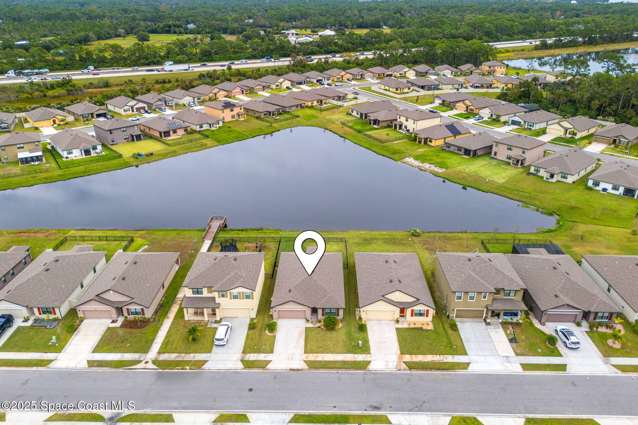 4901 Talbot Boulevard Cocoa, FL 32926 - Photo 32 of 39 an aerial view of residential houses with outdoor space and swimming pool