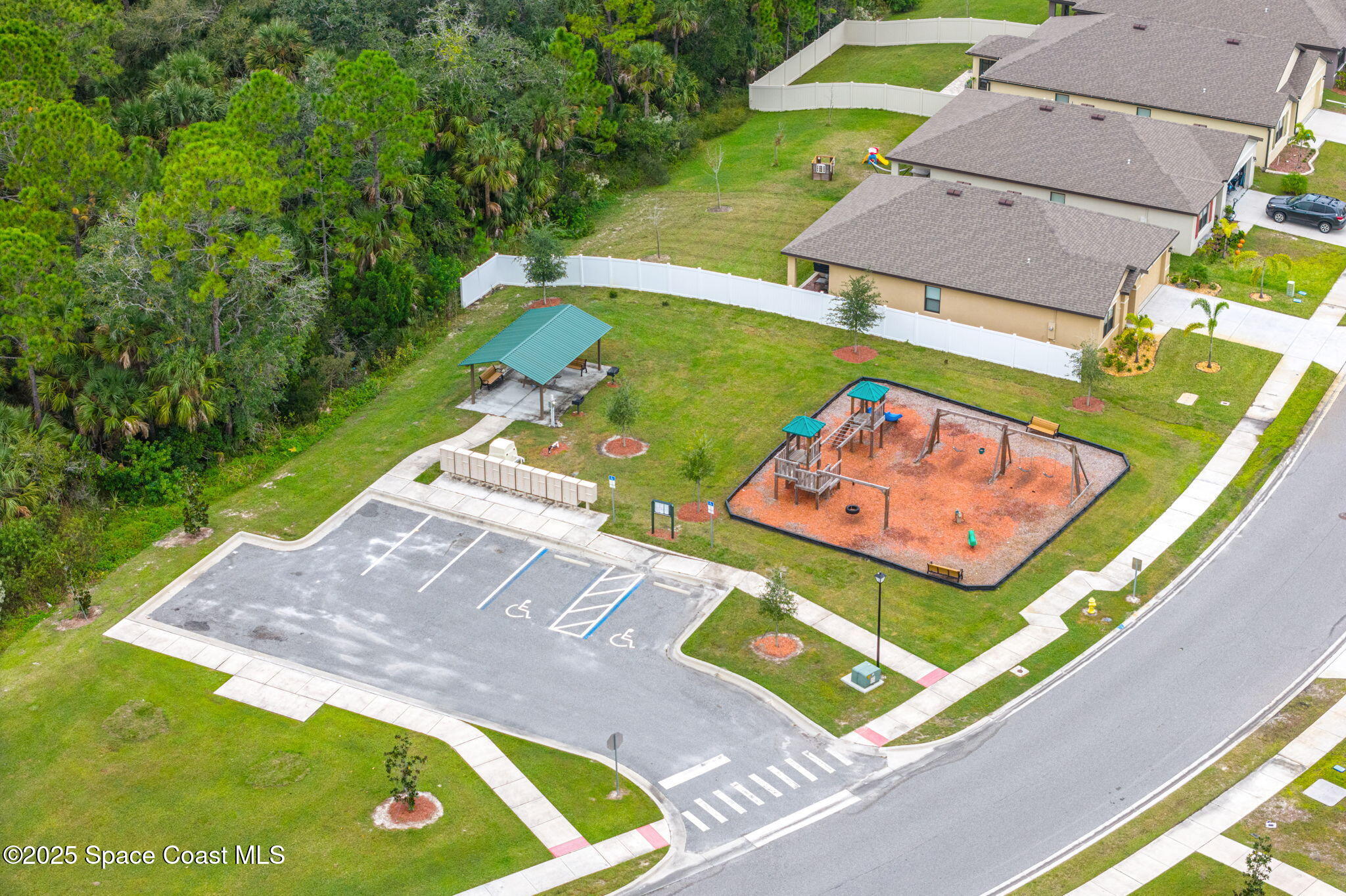 4901 Talbot Boulevard Cocoa, FL 32926 - Photo 33 of 39 an aerial view of a tennis ground with a swimming pool