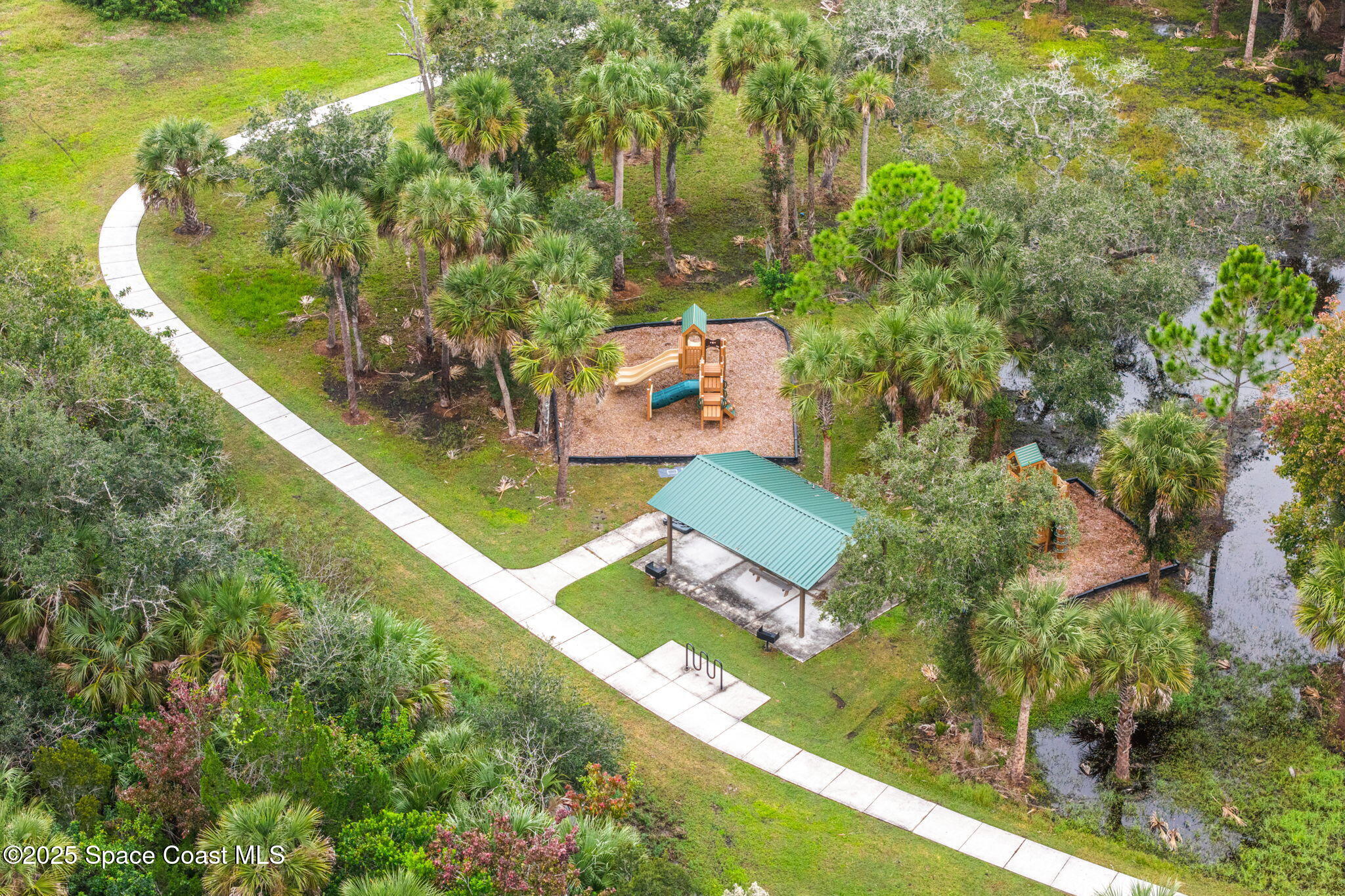 4901 Talbot Boulevard Cocoa, FL 32926 - Photo 38 of 39 an aerial view of a house with a garden and swimming pool