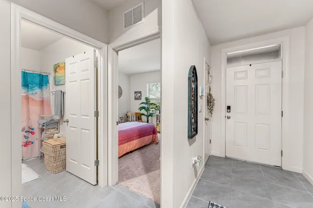 a view of a bedroom with a furniture and closet