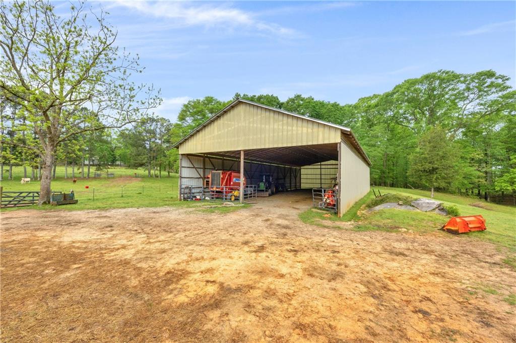2450 Chestnut Grove Road Shiloh, GA 31826 - Photo 11 of 46 a view of a house with a yard and sitting area