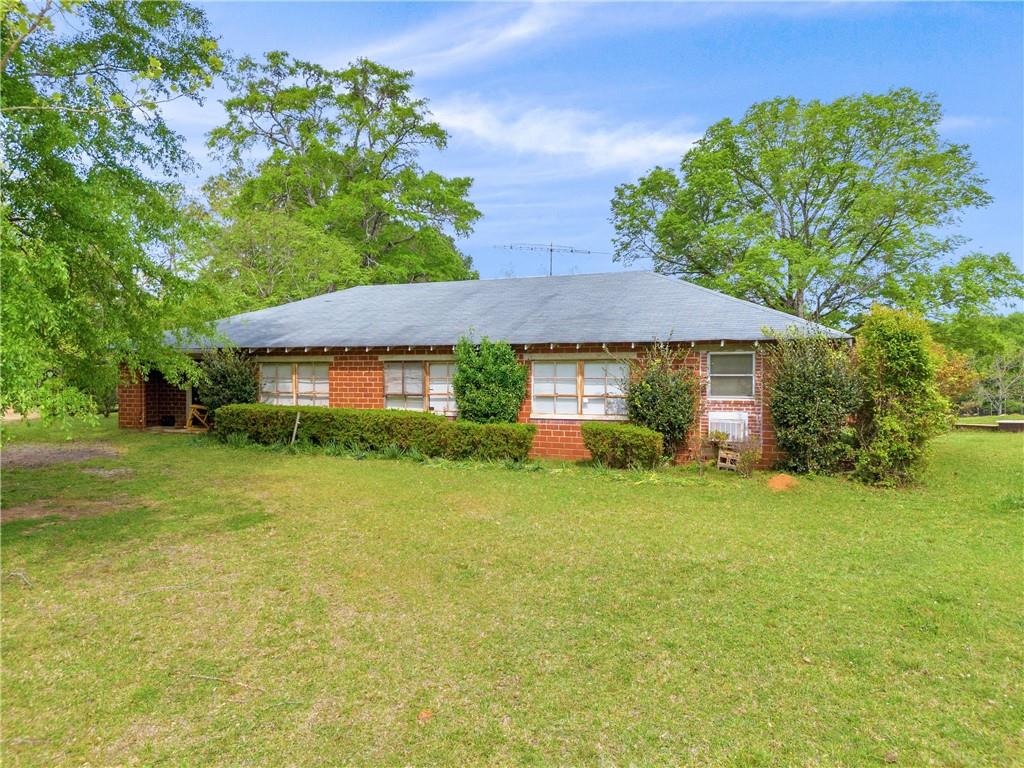 2450 Chestnut Grove Road Shiloh, GA 31826 - Photo 22 of 46 a view of a house with a yard