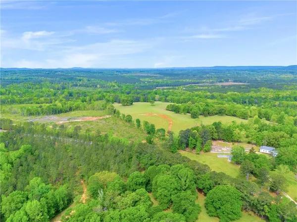 a view of a lake with a yard