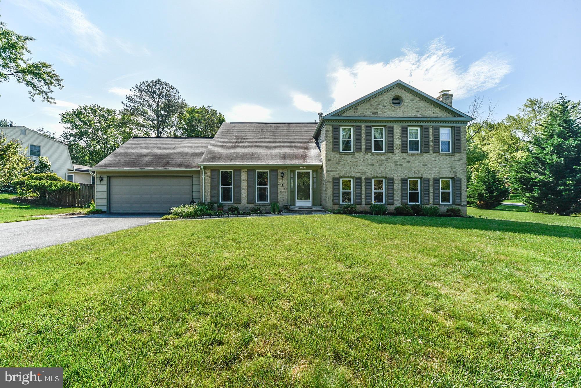 15013 Wellwood Road Silver Spring, MD 20905 - Photo 1 of 30 a front view of a house with a garden