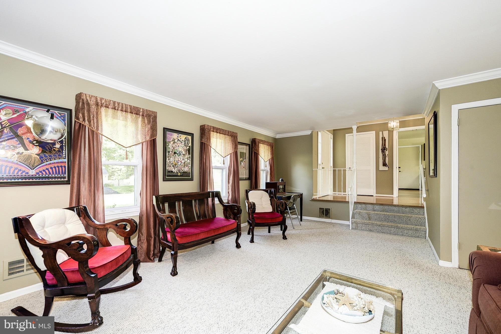 15013 Wellwood Road Silver Spring, MD 20905 - Photo 15 of 30 a living room with furniture and a large window