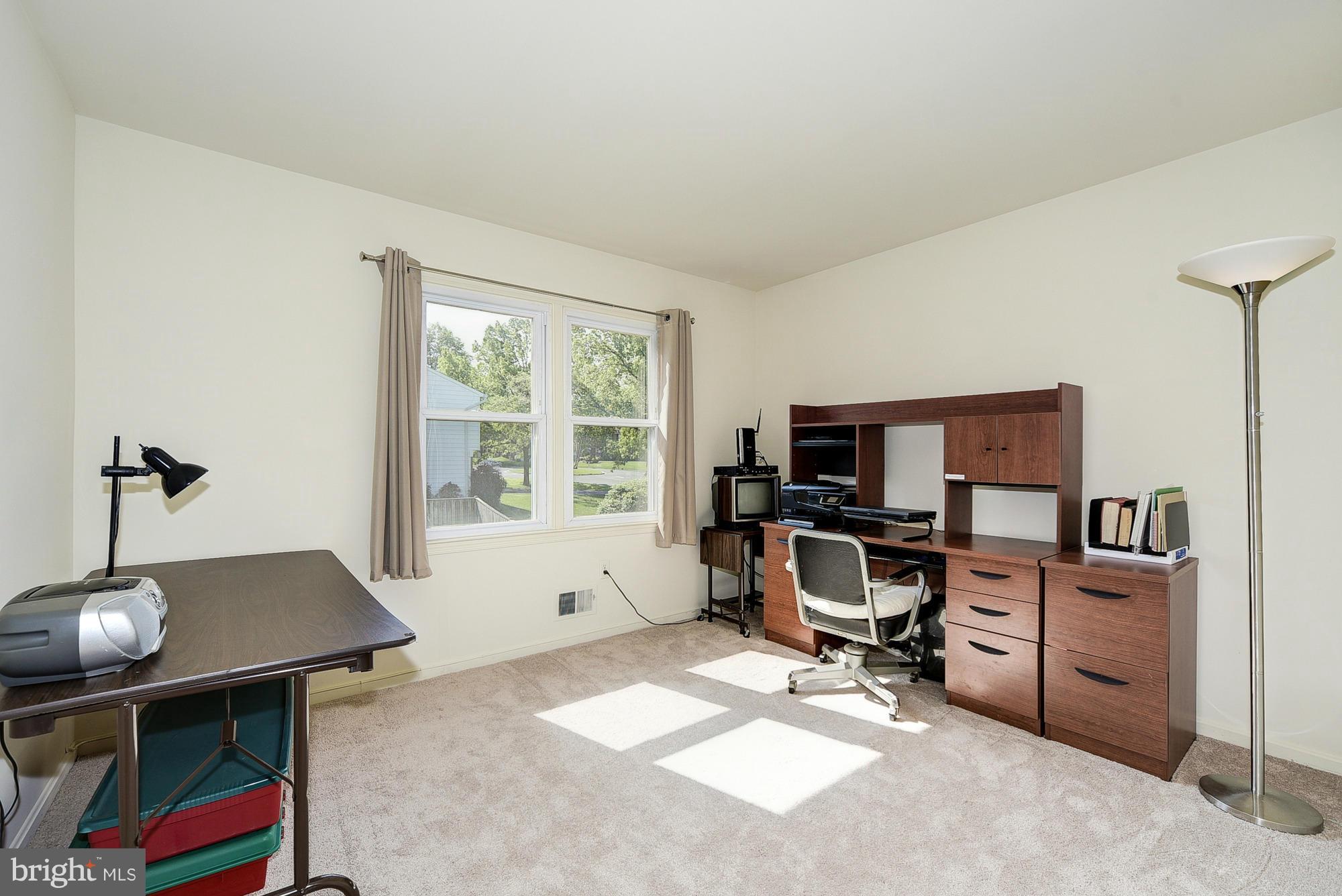 15013 Wellwood Road Silver Spring, MD 20905 - Photo 23 of 30 a view of a workspace with furniture and a window