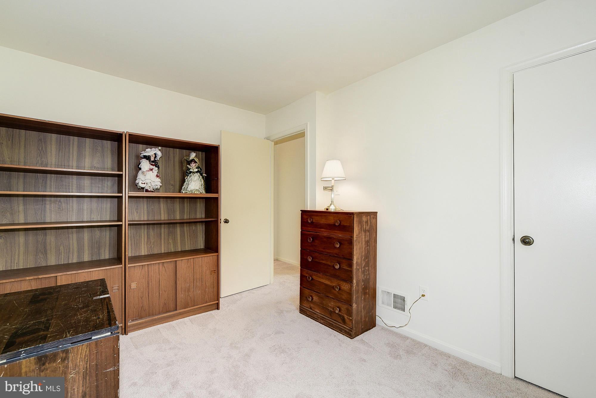 15013 Wellwood Road Silver Spring, MD 20905 - Photo 24 of 30 a view of an empty room with empty shelves