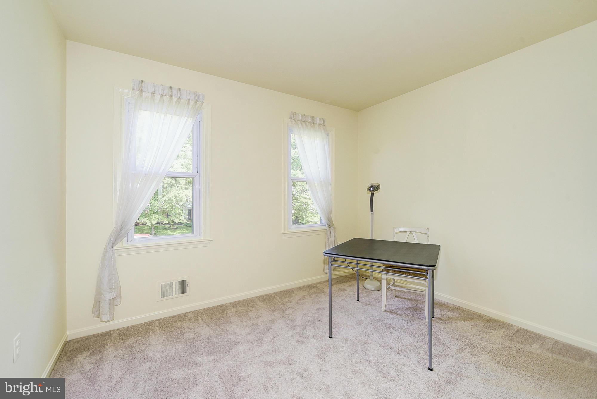 15013 Wellwood Road Silver Spring, MD 20905 - Photo 26 of 30 a view of a workspace with furniture and a window