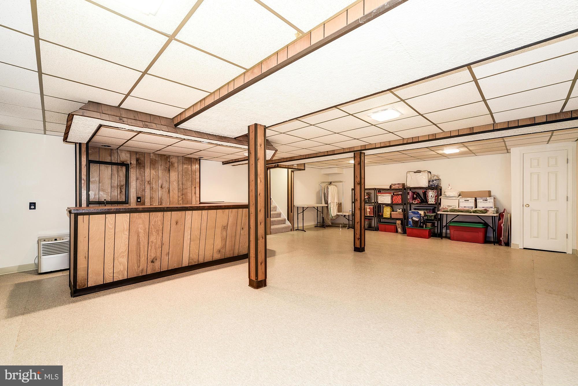 15013 Wellwood Road Silver Spring, MD 20905 - Photo 28 of 30 a view of a garage with wooden floor
