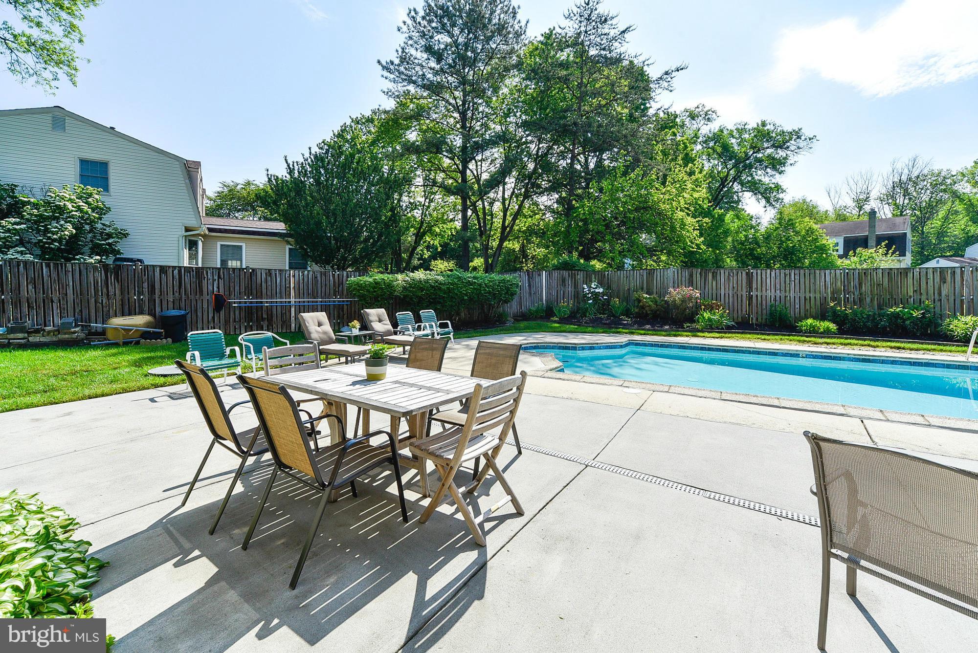 15013 Wellwood Road Silver Spring, MD 20905 - Photo 5 of 30 a view of a backyard with a table and chairs