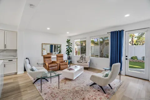 a living room with furniture flat screen tv and a fireplace