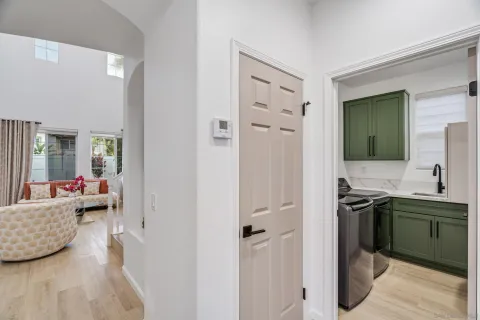 a living room with furniture and a book shelf