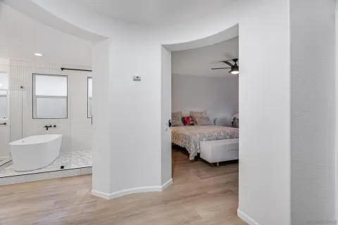 a bedroom with a bed and a couch