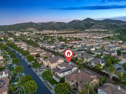 a view of a chair and tables in patio