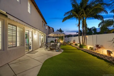 an aerial view of multiple houses with yard