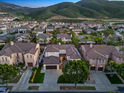 an aerial view of a house with a garden