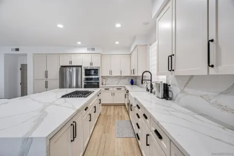 a kitchen with a table and chairs in it