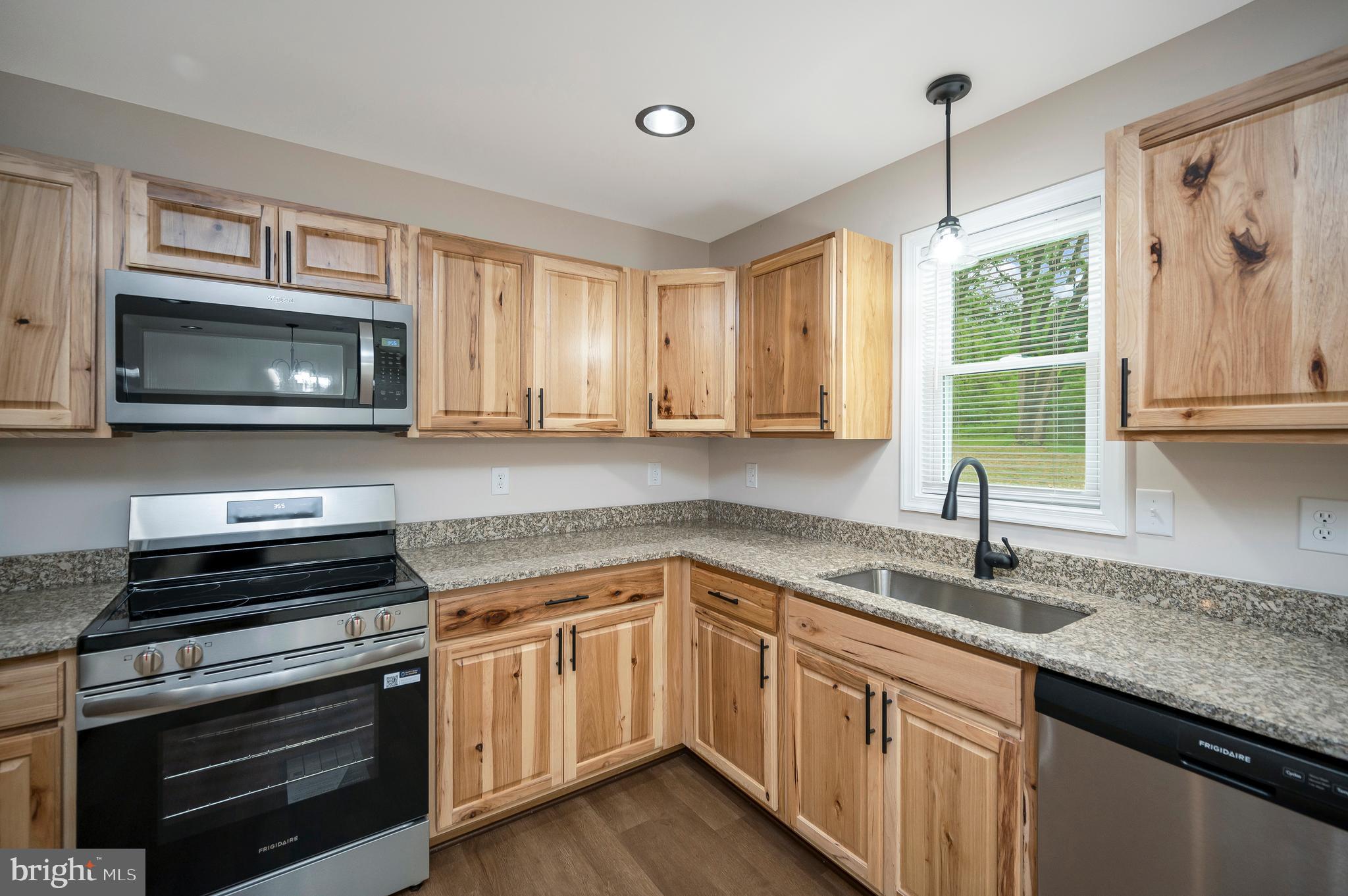 14169 Silver Hill Road Sumerduck, VA 22742 - Photo 15 of 40 a kitchen with a sink stove and microwave
