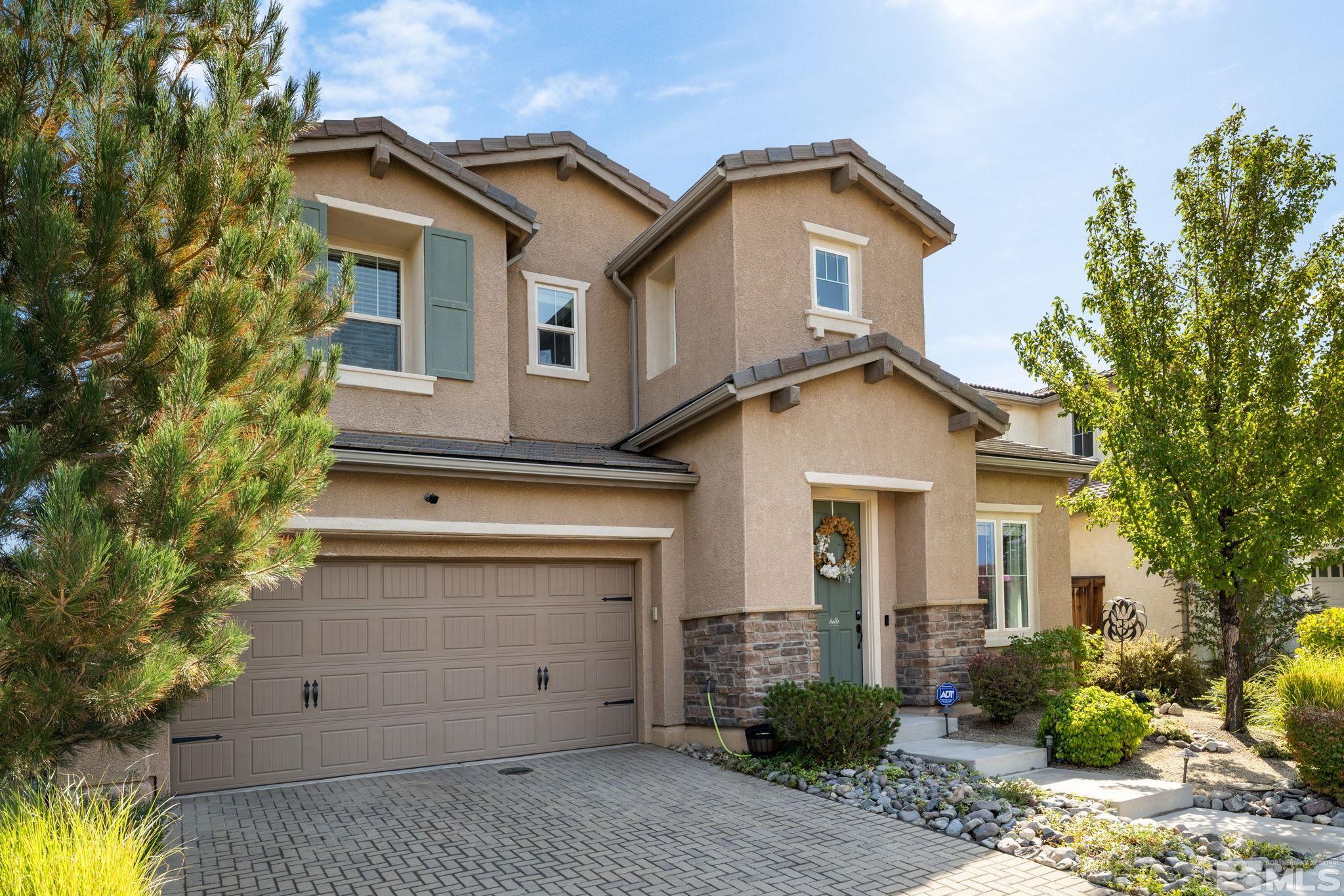 9390 Lost Valley Road Reno, NV 89521 - Photo 1 of 26 a view of a house with a yard and plants