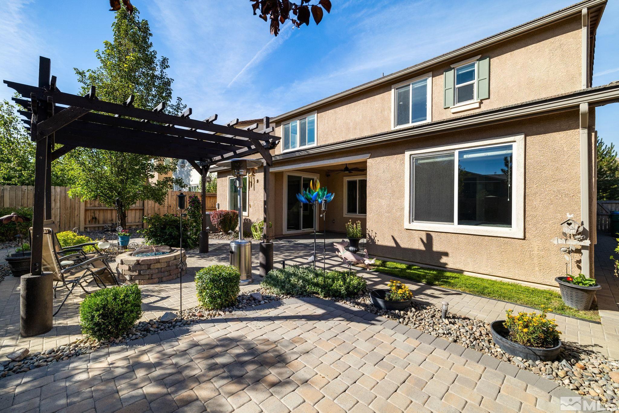 9390 Lost Valley Road Reno, NV 89521 - Photo 24 of 26 a front view of a house with garden