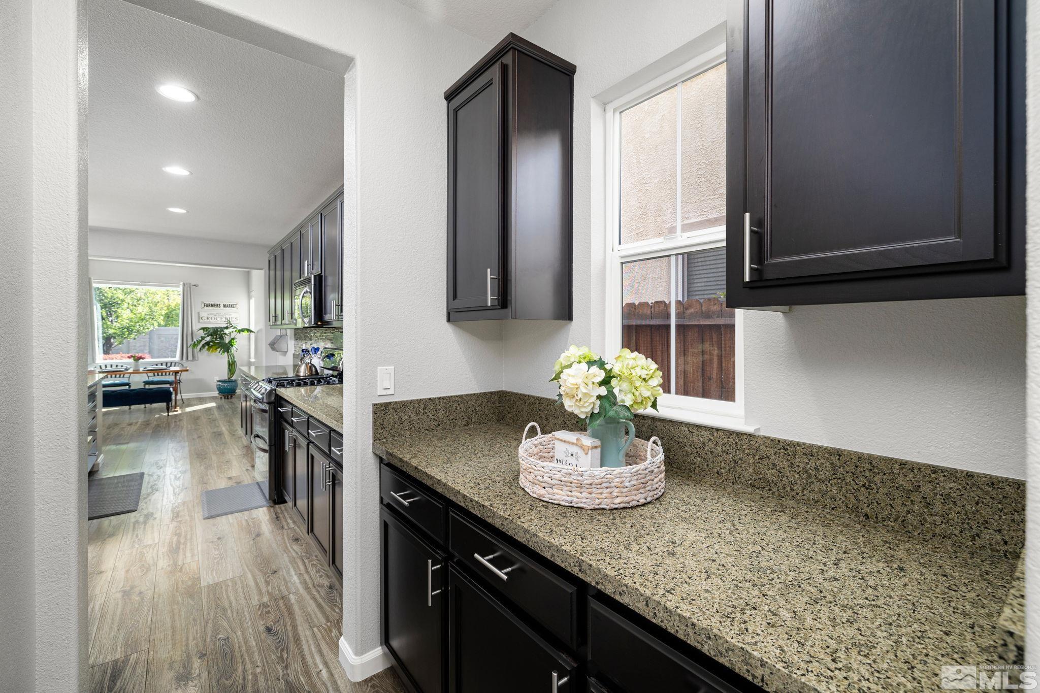 9390 Lost Valley Road Reno, NV 89521 - Photo 4 of 26 a kitchen with a sink and cabinets