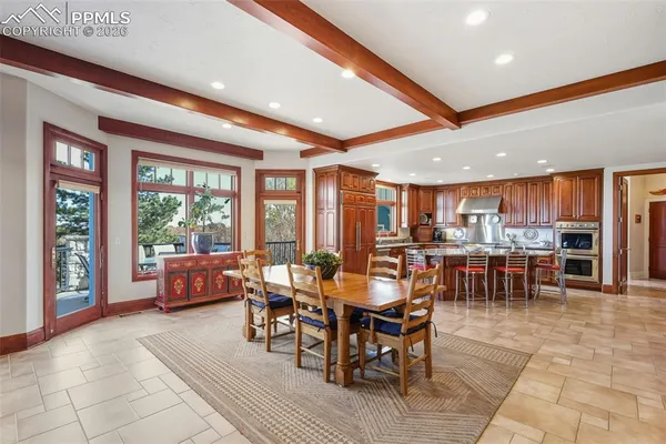 a view of a dining room with furniture window and outside view