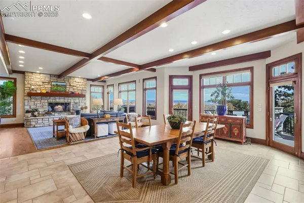 a view of a dining room with furniture window and outside view