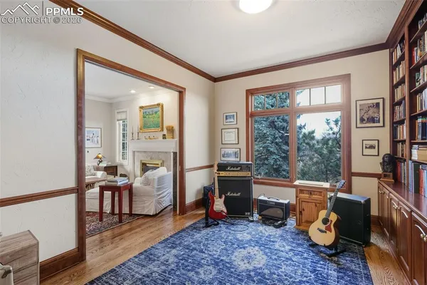 a living room with furniture and a floor to ceiling window