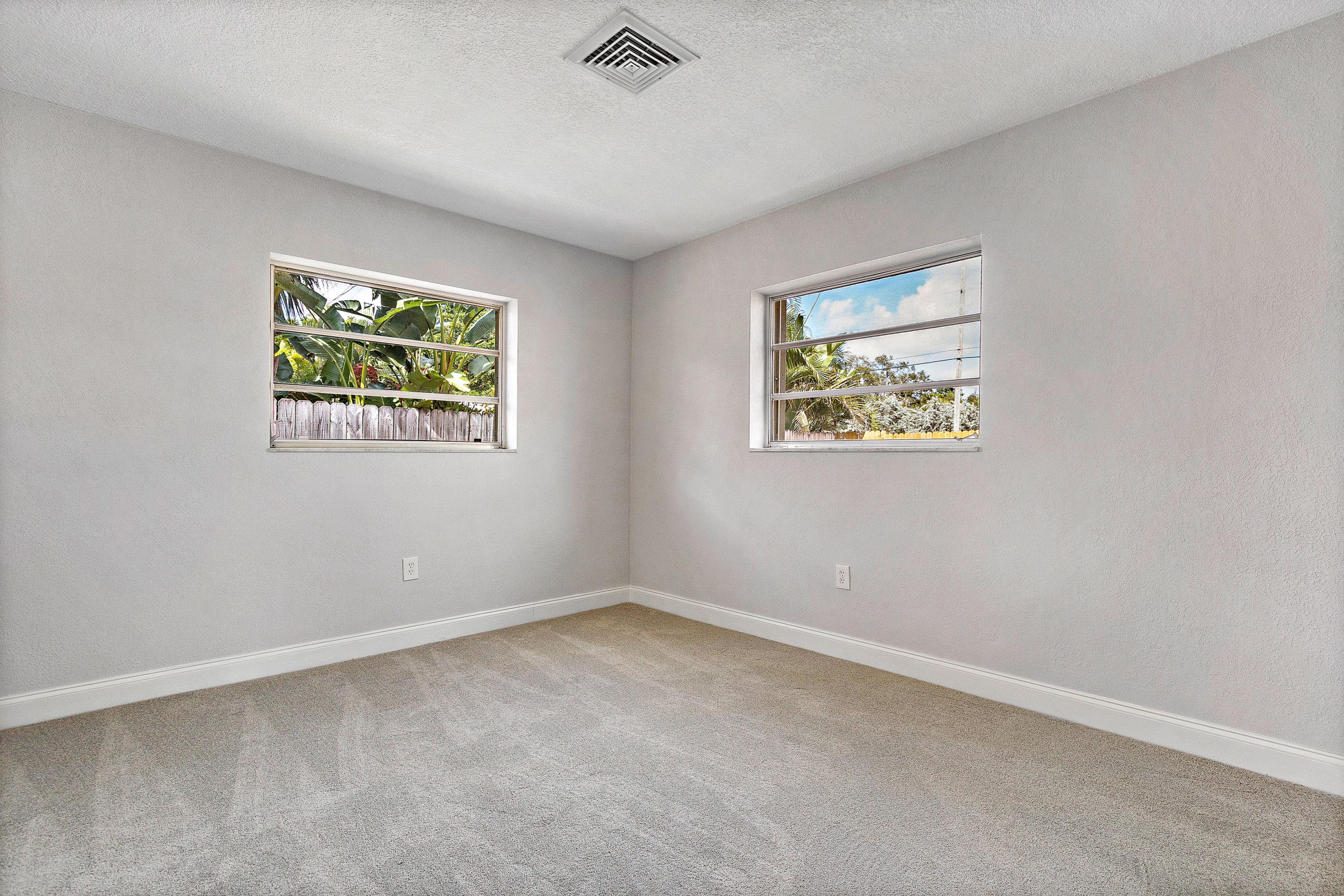 871 Northwest 7th Street Boca Raton, FL 33486 - Photo 19 of 21 an empty room with windows