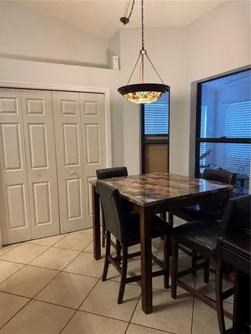 a kitchen with a refrigerator a stove and a sink