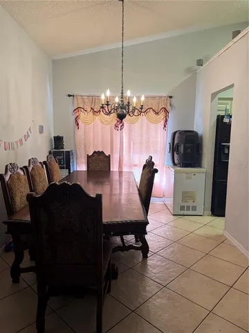 a room that has a table and chairs in it