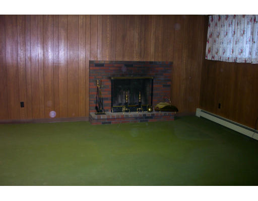 37 Ridge Road Revere, MA 02151 - Photo 11 of 18 a view of a livingroom with furniture and fire place