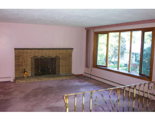 37 Ridge Road Revere, MA 02151 - Photo 5 of 18 a view of an empty room with a fireplace