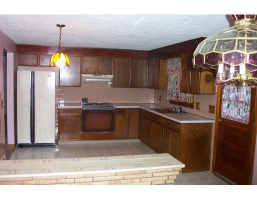 37 Ridge Road Revere, MA 02151 - Photo 8 of 18 a kitchen with granite countertop a sink cabinets and stainless steel appliances