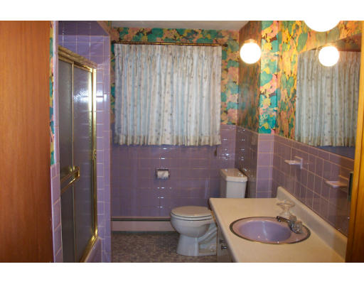 37 Ridge Road Revere, MA 02151 - Photo 10 of 18 a bathroom with a toilet a sink and a mirror