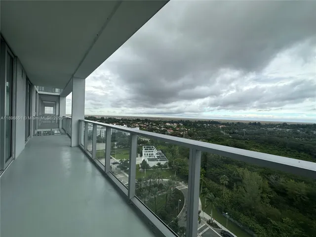 a view of a balcony with an outdoor space