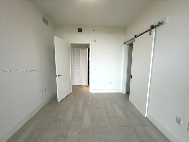 a bathroom with a sink a mirror and a bathtub